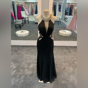 Size 12. black matte dress. sheer keyhole cutouts. studded neckline. trumpet